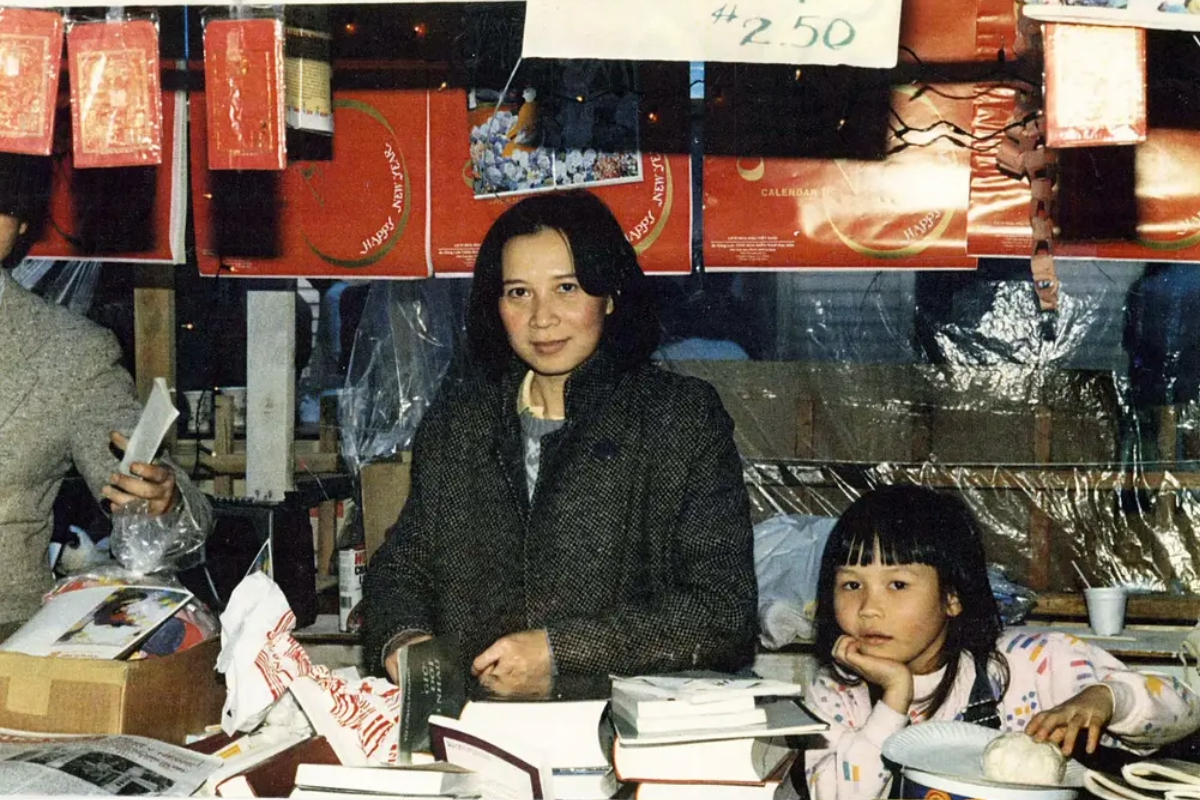 Phạm and her mother, Hằng Nga, worked a booth for the newspaper at a Tết Festival, or Lunar New Year, at Chùa Cổ Lâm, the largest Vietnamese Buddhist temple in Seattle, in 1987. "As a child, I knew it was Tết time by trays of special Tết candy and the red envelopes of lucky money I got from relatives and my parents’ friends when I bowed and recited the special Tết  greeting," Pham wrote on her blog.